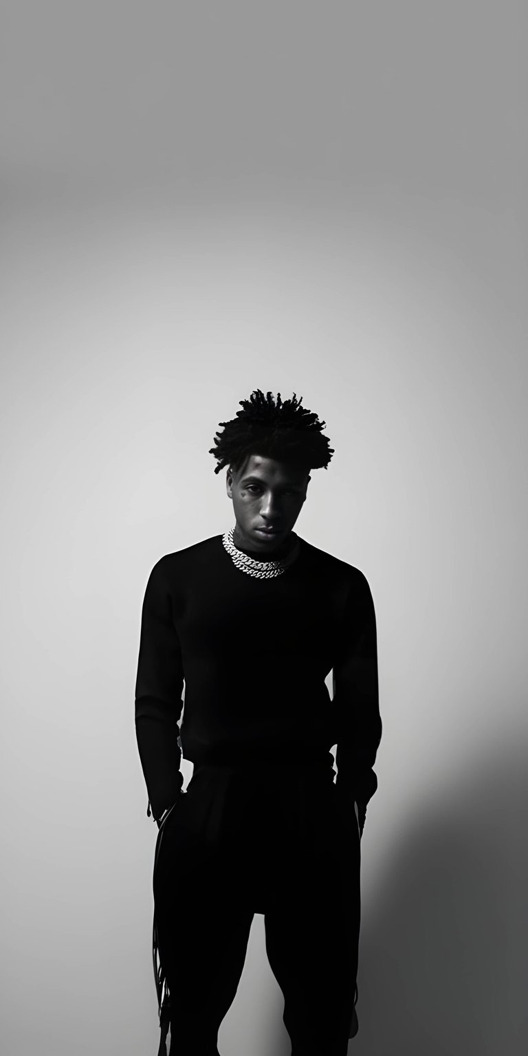 This 3D Spatial wallpaper features a striking monochrome portrait of NBA YoungBoy against a bold red background. It is a high-energy aesthetic wallpapers choice designed to pop on your iPhone lock screen.