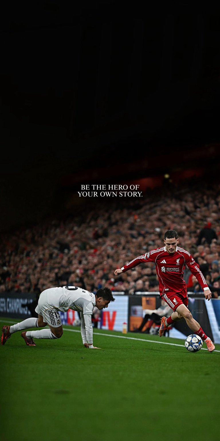 The image shows Liverpool player Florian Wirtz playing against a Real Madrid player in a Champions League match 4k football wallpaper