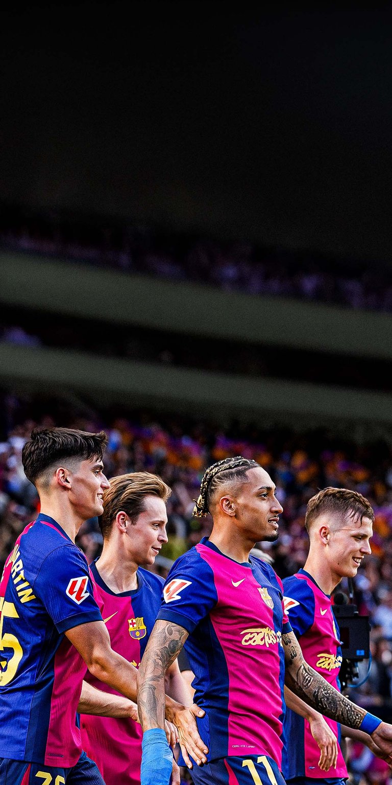 Raphinha of FC Barcelona celebrates scoring his team's fourth goal with teammates Wallpaper