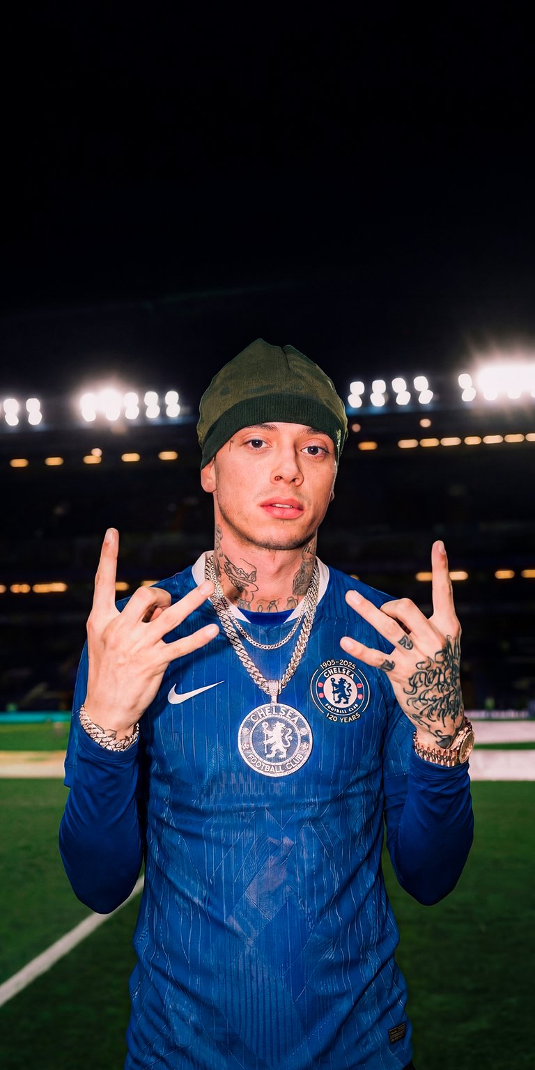 Download this awesome Central Cee 4K wallpaper for your iPhone, showcasing the rapper in his Chelsea jersey. This eye-catching wallpaper highlights Central Cee's unique style, featuring his neck tattoos, hand tattoos, and iced-out chain.