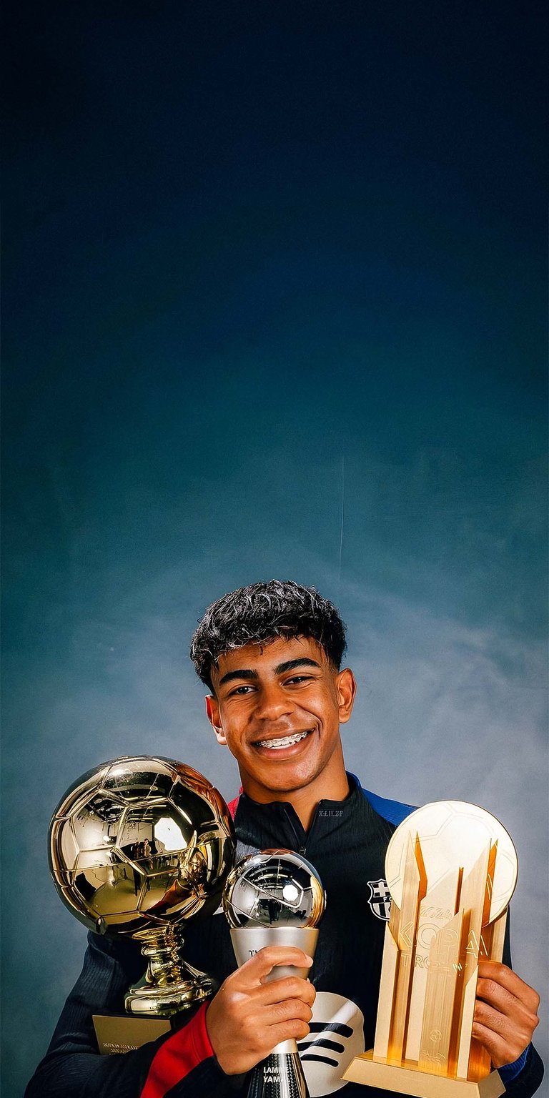 Lamine Yamal portrait with his trophies wallpaper
