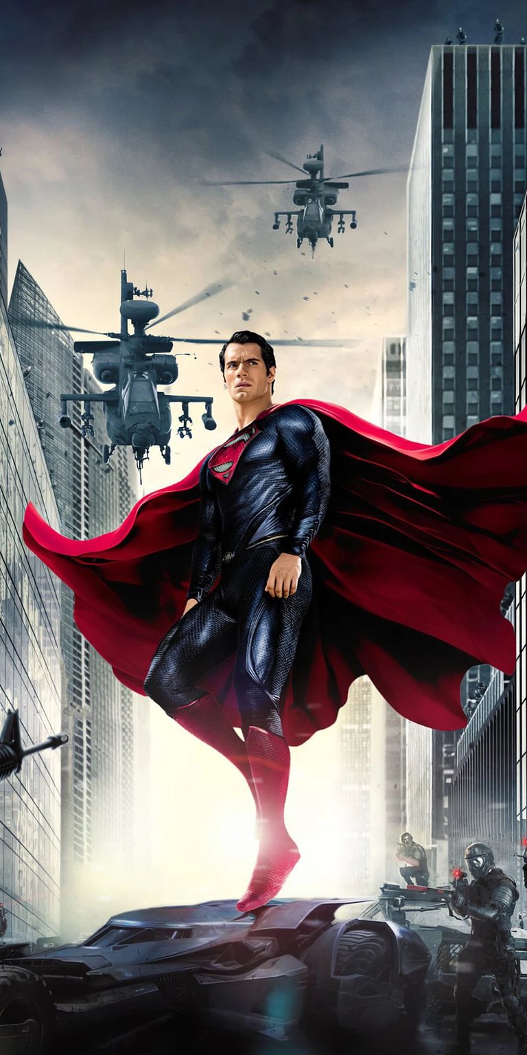 Download this epic Superman 4K wallpaper for your iPhone, featuring the Man of Steel amidst a chaotic urban battle. Helicopters soar overhead as Superman stands defiantly on a damaged vehicle, his red cape billowing in the wind.
