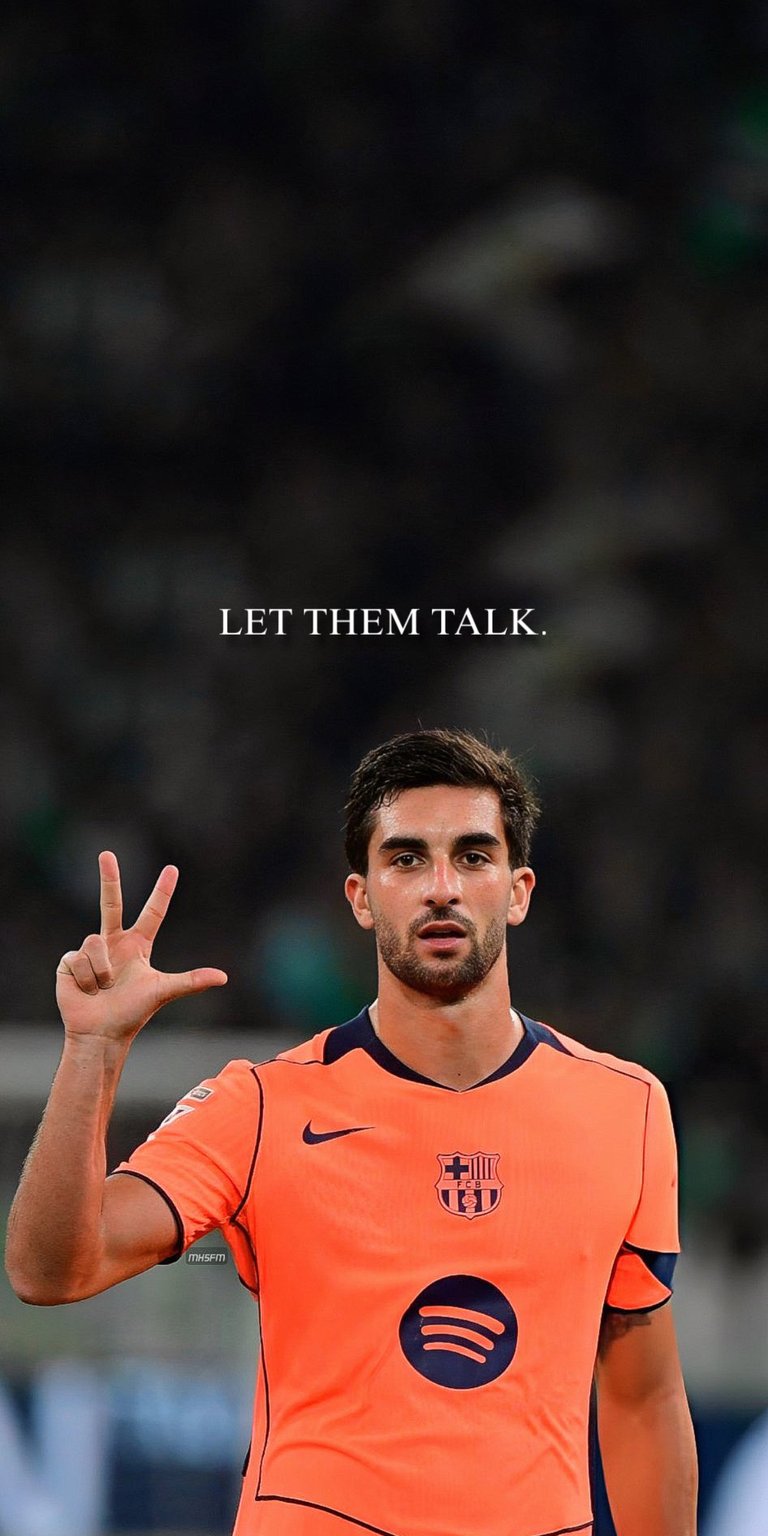 This cool and confident live wallpaper features Ferran Torres of FC Barcelona making a peace sign gesture. The player, in the team's orange kit, is seen in a relaxed but determined pose. The overlay quote, "Let them talk," gives the wallpaper an attitude of focusing on the game and ignoring the critics. This is a great choice for fans who love the blend of sports and personal confidence.