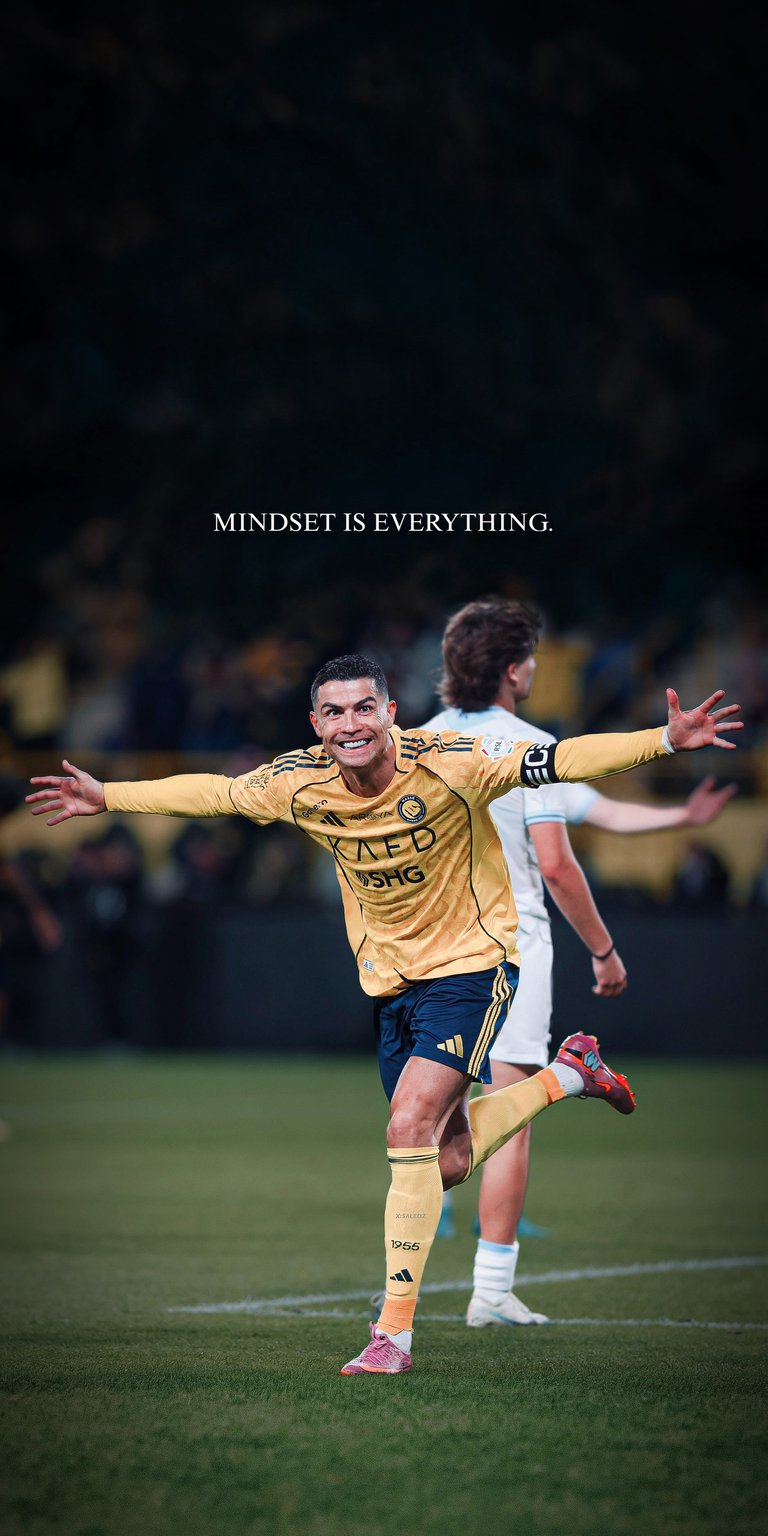 Elevate your screen with the legendary CR7 in his iconic Al Nassr yellow kit. This high-definition wallpaper captures Cristiano Ronaldo in a moment of triumph, featuring the inspiring text "MINDSET IS EVERYTHING." Set against a professionally blurred pitch background, it’s the perfect motivation for any football fan or athlete.