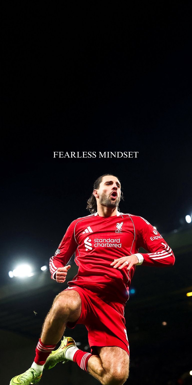 Dominik Szoboszlai Static wallpaper featuring the midfielder in a red kit running under bright stadium lights. This wallpaper highlights motion, intensity, and sharp contrast in a bold Aesthetic wallpapers style, perfect for iPhone lock screen and home screen.