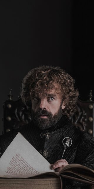 Tyrion Lannister holding a book wallpapers