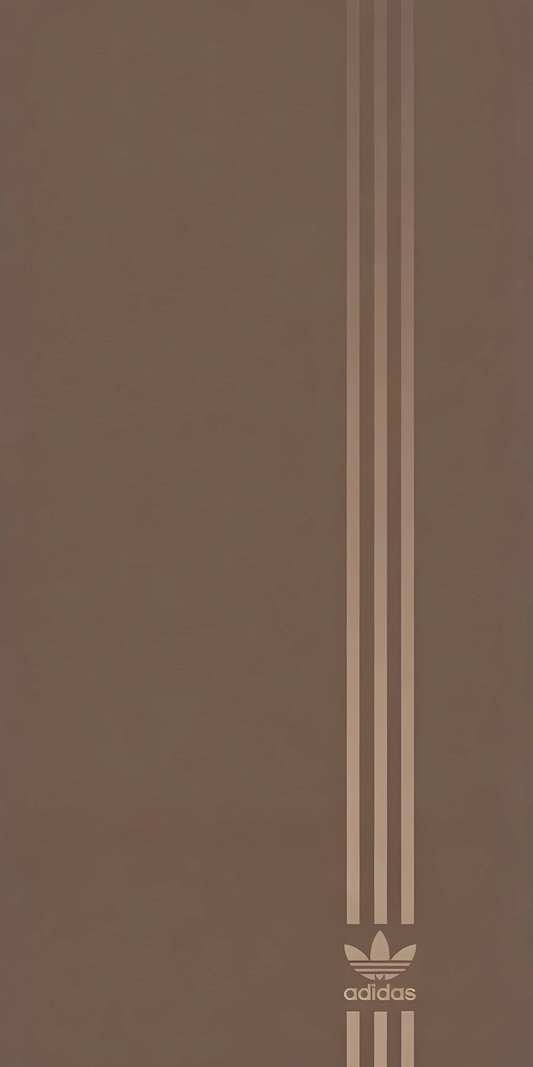 Download this Adidas wallpaper in 4K resolution for your iPhone! This high-quality wallpaper showcases the iconic three stripes and trefoil logo against a clean background.