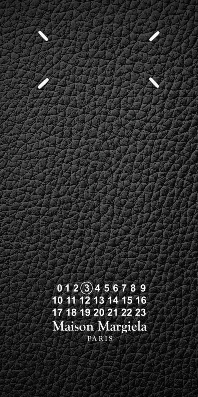 This Maison Margiela 4K wallpaper is perfect for your iPhone, showcasing a textured black leather background. The image features the brand's iconic number grid and four stitch details.