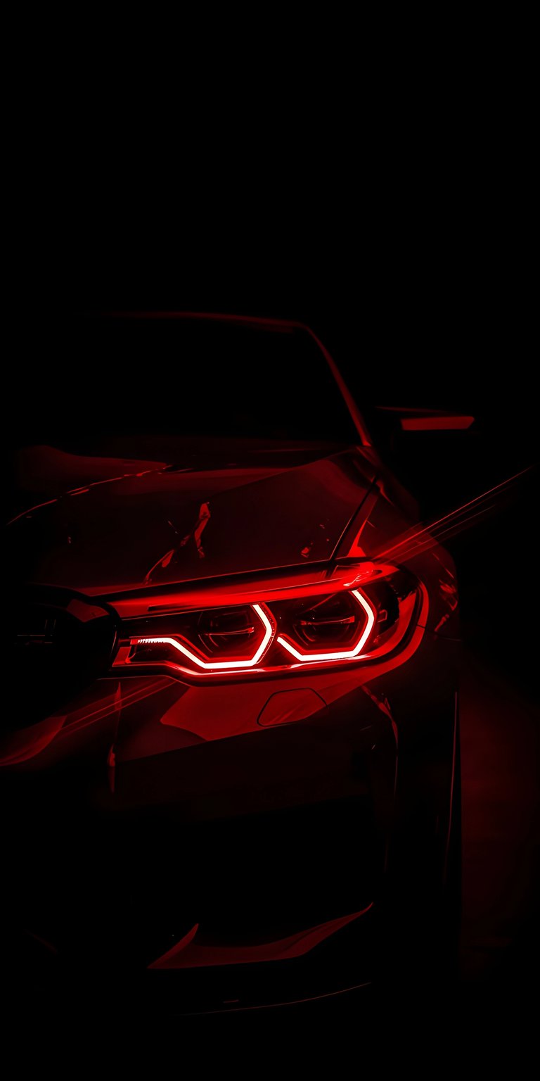 Upgrade your iPhone with this aggressive BMW M5 4K OLED wallpaper featuring the iconic glowing red adaptive LED headlights. This wallpaper utilizes deep black tones and sharp crimson light streaks to create a high-contrast, premium automotive mood.