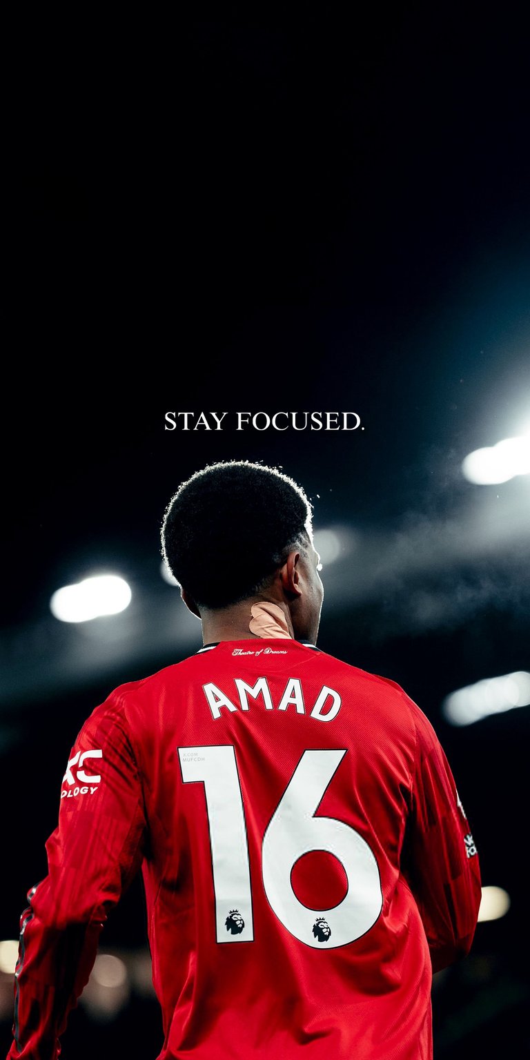 Capture the determination of United's winger with this stunning "Stay Focused" Amad Diallo wallpaper. Featuring the iconic #16 red jersey against a dramatic, cinematic lighting backdrop, it’s designed for a clean and professional look.