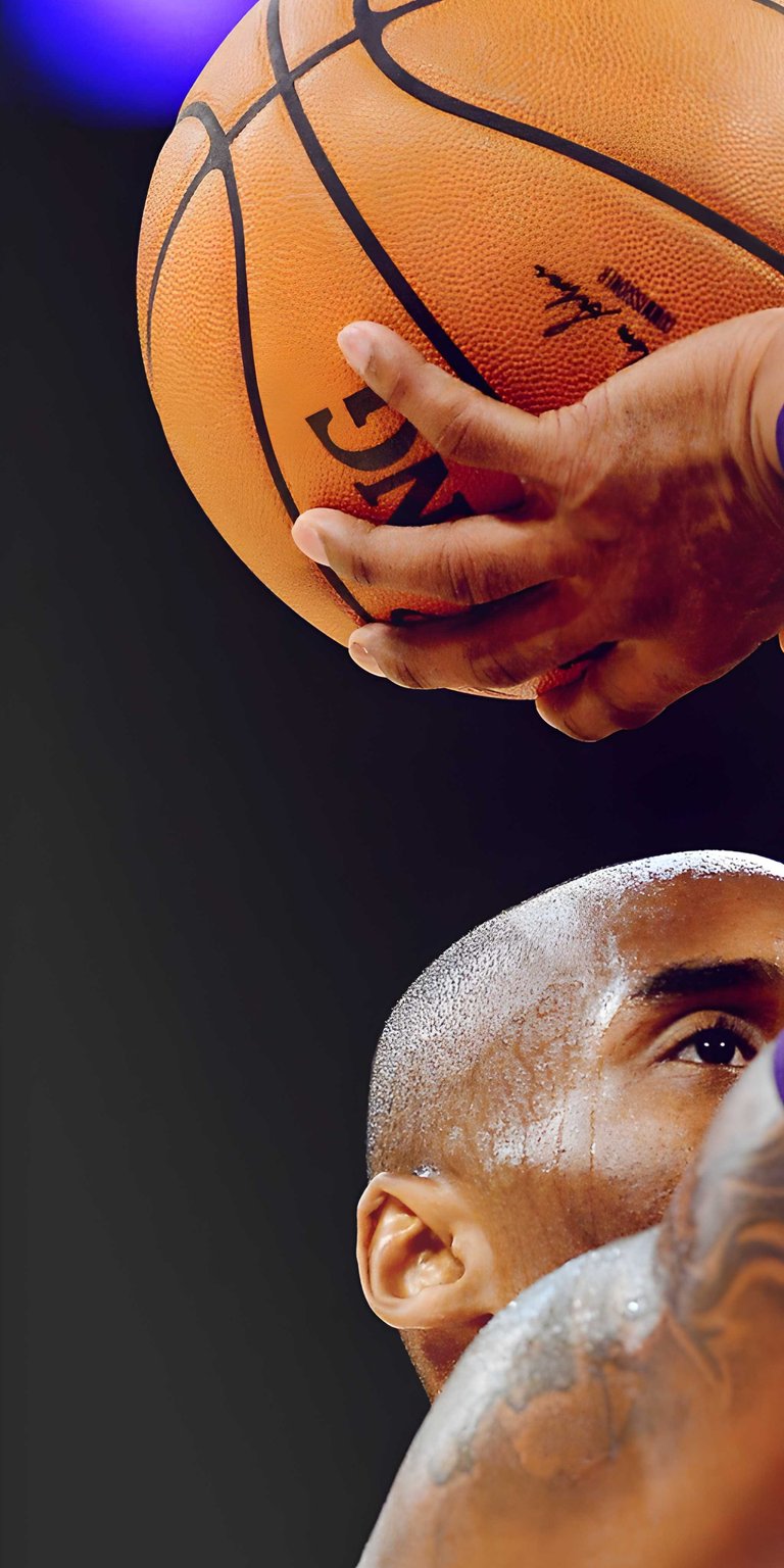 Honor the Mamba with this Kobe Bryant 4K wallpaper featuring a close-up of the legend and a basketball. This emotional sports wallpaper for iPhone captures the intensity and legacy of the Los Angeles Lakers icon.