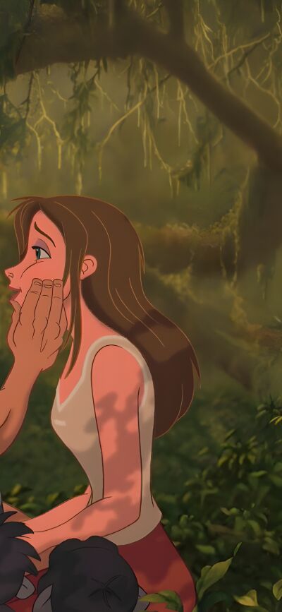 Enjoy this Tarzan and Jane matching 4K wallpaper on your iPhone. This wallpaper features a muscular Tarzan in a jungle and Jane with her face being touched.