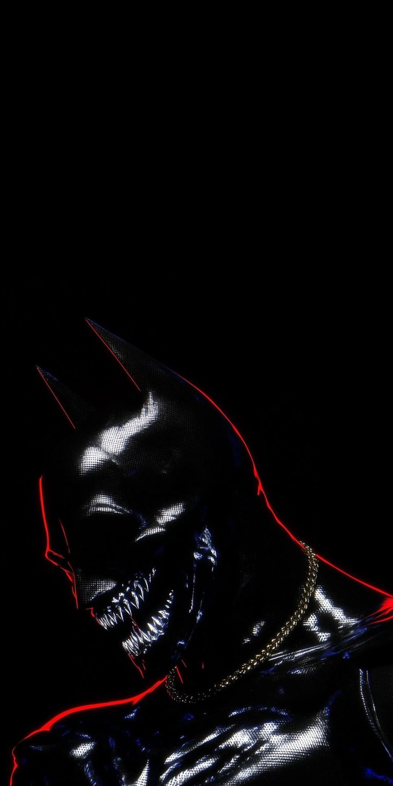 Download this Batman villain 4K wallpaper for your iPhone, showcasing a horrifying take on the dark knight. This wallpaper captures the villain's sharp teeth, golden chain, and the red outlines.