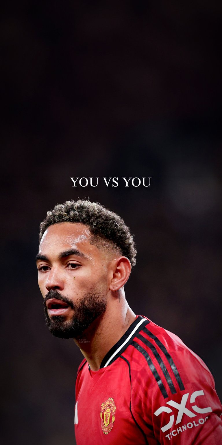 Download this cunha 4K wallpaper for your iPhone to showcase the promising Manchester United player. This wallpaper highlights his curly hair, red jersey with the Manchester United logo, and the empowering message 'YOU VS YOU'.
