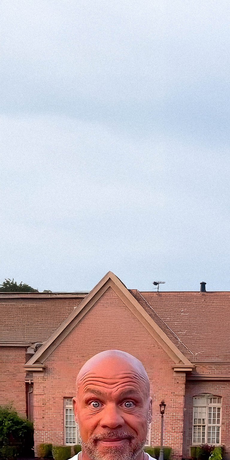Kurt Angle with a big house at his background wallpaper