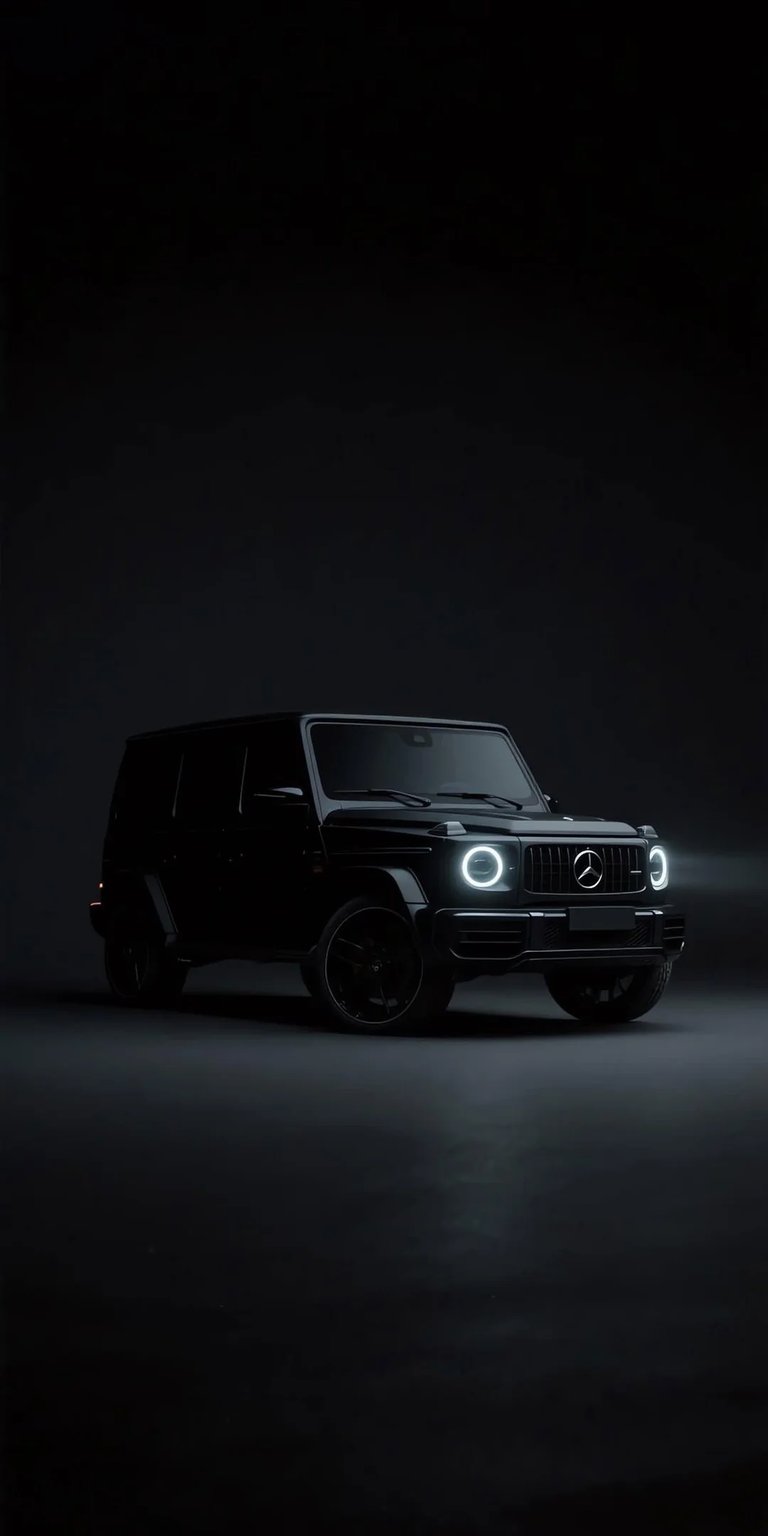 Black G Wagon 4K wallpaper with deep shadows, studio lighting, and glowing headlights. This AMOLED wallpaper enhances iPhone lock screen and home screen displays with rich blacks and bold luxury SUV styling.