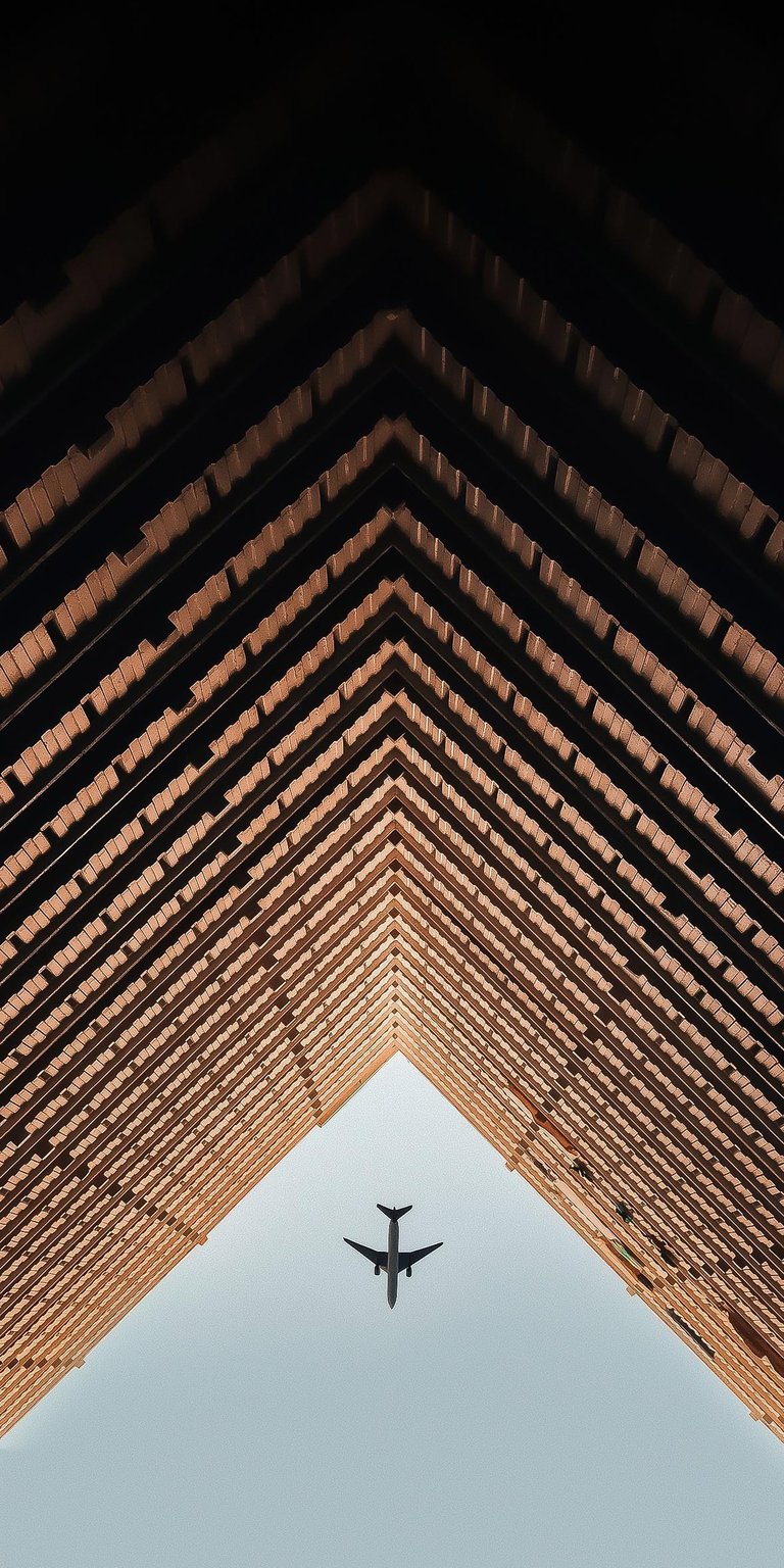 Plane over building wallpaper iPhone HD