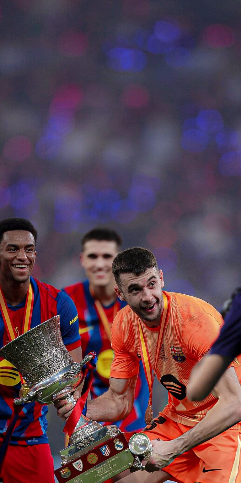 Download this Inaki Pena 4K wallpaper for your iPhone, showcasing the soccer star celebrating with a trophy and wearing an orange jersey. This awesome wallpaper will make your mobile device stand out!