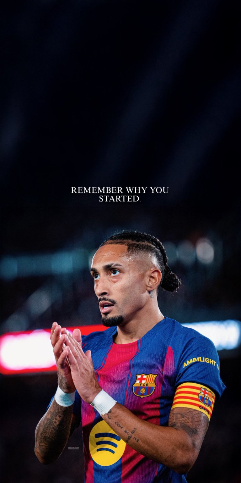 A striking 4K live wallpaper featuring Raphinha of FC Barcelona with his hands clasped in a moment of reflection or prayer after scoring. The impactful scene is overlayed with the text "REMEMBER WHY YOU STARTED" and is perfect for fans of La Liga and inspirational sports themes.