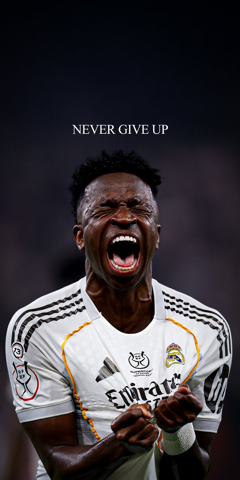 Download this Vinicius Jr 4K wallpaper for your iPhone, showcasing his electrifying celebration with a motivational 'Never Give Up' message. This wallpaper highlights his intense expression, the Real Madrid jersey, and the celebratory moment.