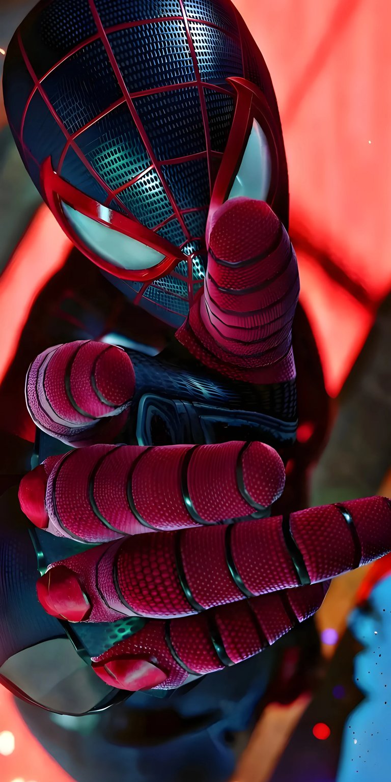 Get this amazing Miles Morales wallpaper in 4K for your iPhone! This wallpaper showcases his iconic mask, red web patterns on his gloves, and his sleek black suit.