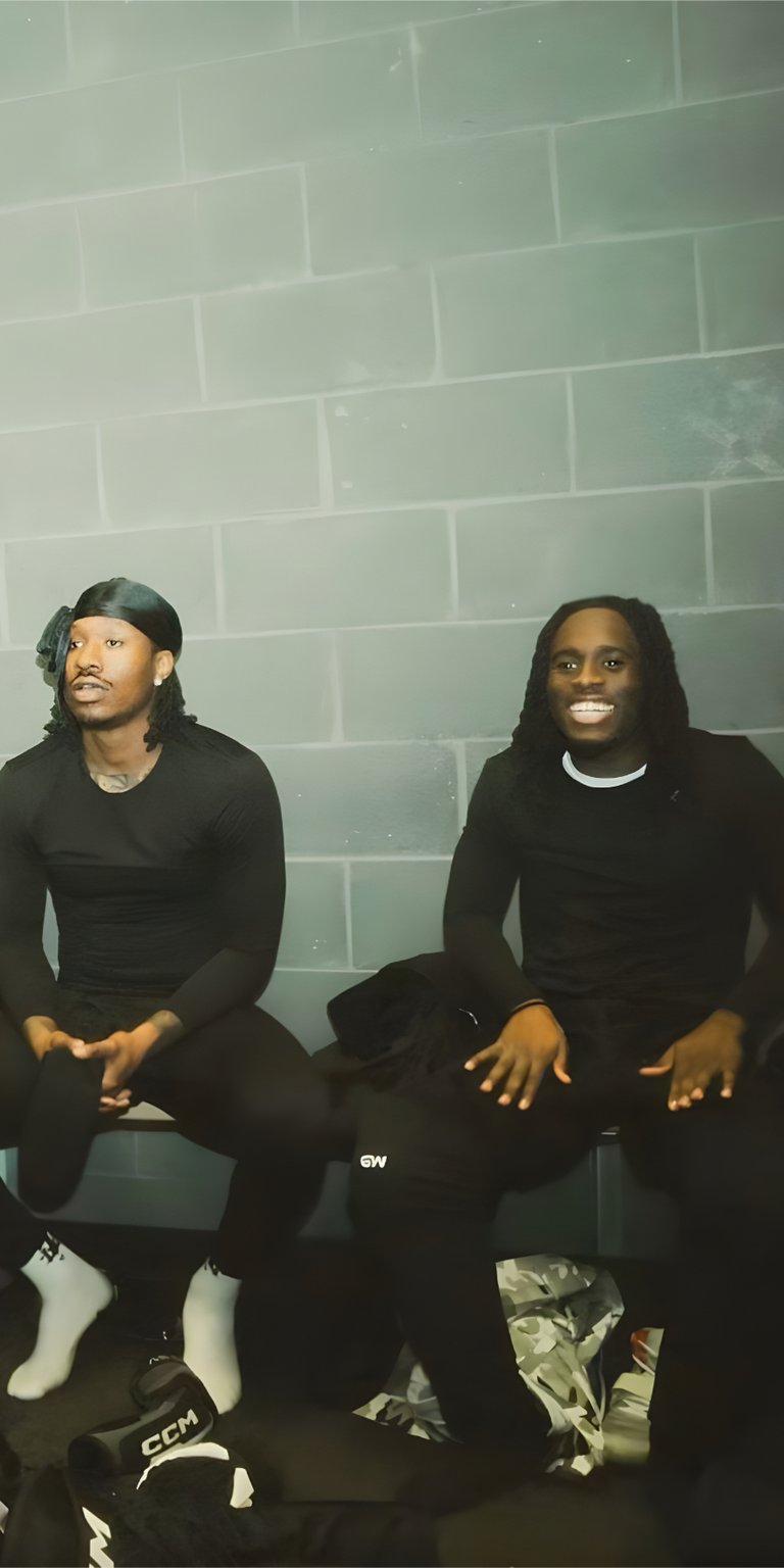 person man black floor sit tile wall dressing room kai cenat streamer twitch hockey