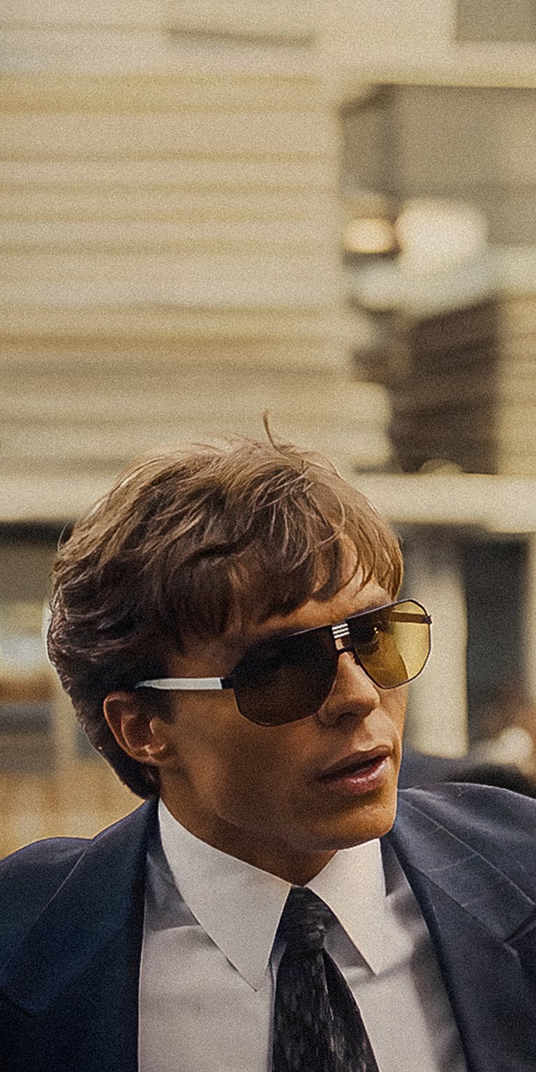 Lyle Menendez wearing sunglasses and business suit wallpaper