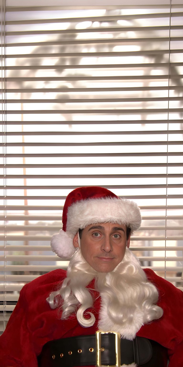 Get this Michael Scott Santa 4K wallpaper for your iPhone, featuring a Santa hat, a fake beard, and office blinds. This wallpaper captures Michael in his full Santa suit.