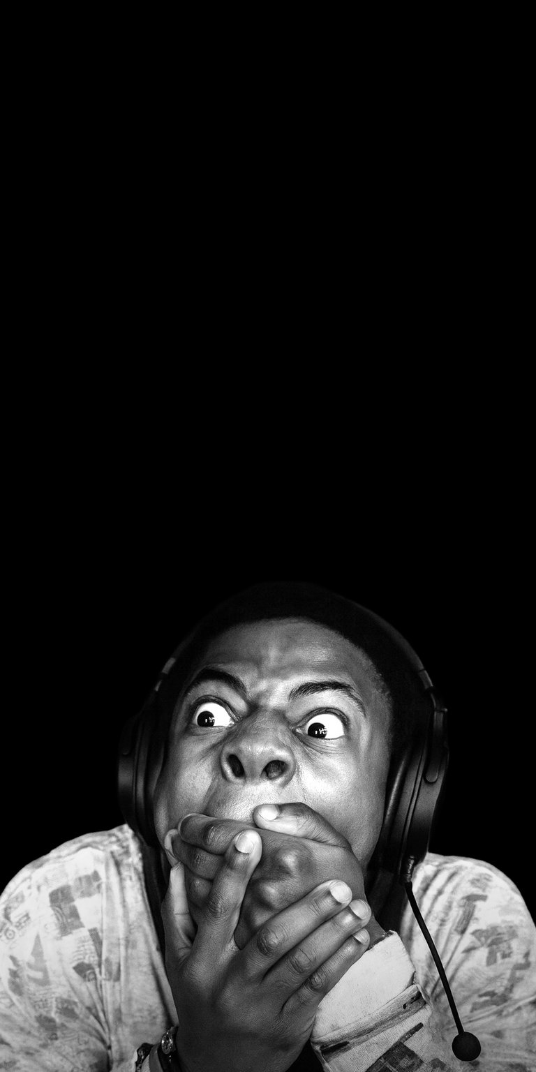 Download this Deestroying wallpaper in stunning 4K for your iPhone, showcasing a black and white aesthetic, wide-eyed expression, and prominent headphones. Elevate your screen with this striking wallpaper.