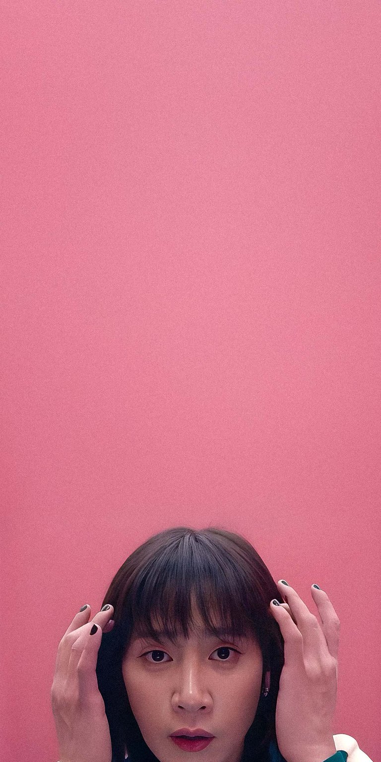 Hyun-ju portrait pink background fixing hair 4k wallpaper