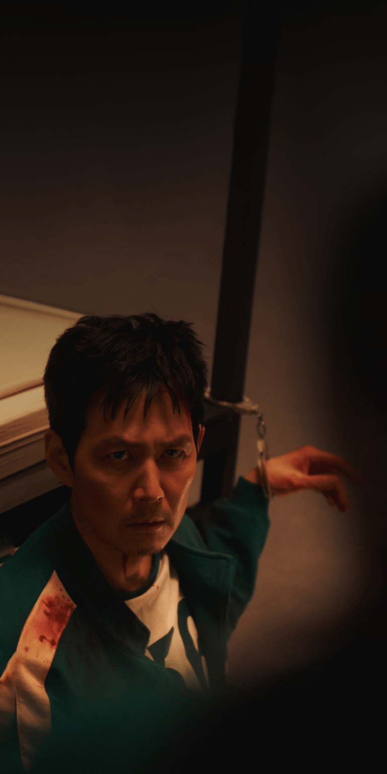 Seong Gi-hun handcuffed wallpaper 4k iPhone