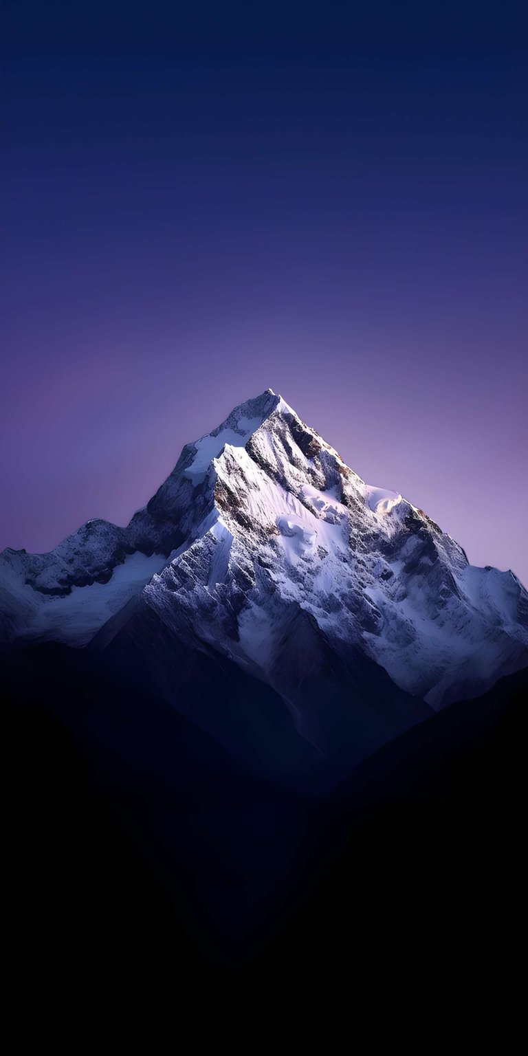 This 4K OLED wallpaper features a sharp, snow-capped mountain peak against a deep purple twilight sky. Perfect for an iPhone, the wallpaper utilizes high contrast and dark shadows to create a serene, majestic mood.