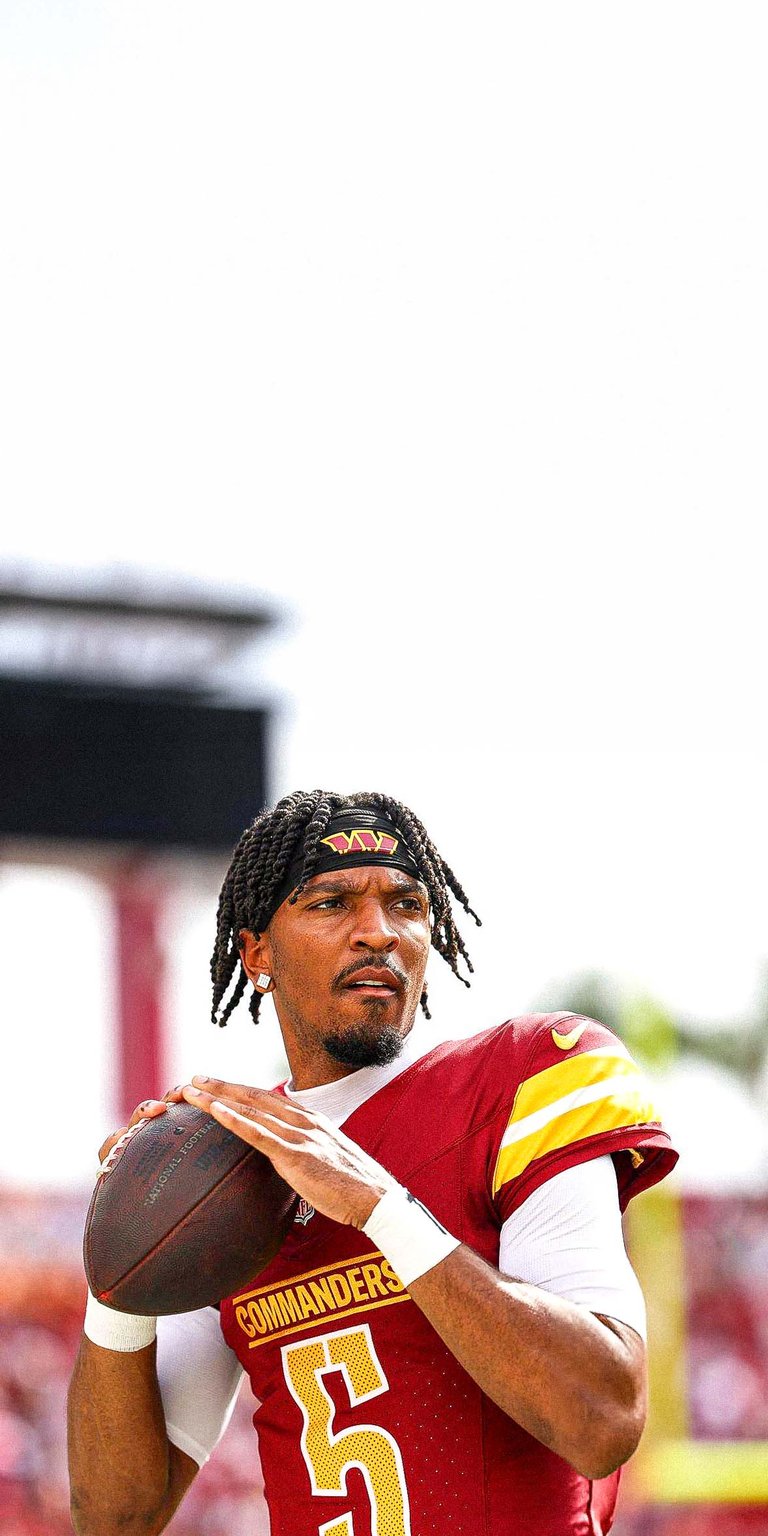 Jayden Daniels of the Washington Commanders warms up Wallpaper