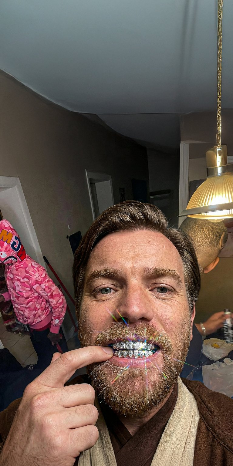 Elevate your iPhone with this unique 4K wallpaper featuring Obi-Wan Kenobi rocking diamond-encrusted grills. Part of our aesthetic wallpapers collection, this design showcases warm lighting and sharp, sparkling details for a playful, modern vibe.