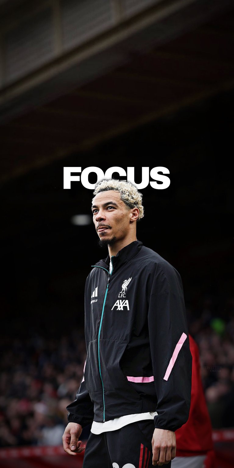 Download a stunning ekitike4K wallpaper for your iPhone, showcasing the Liverpool star in a sleek black jacket with pink accents and his signature blonde-tipped hair. This wallpaper will bring the focus to your screen.