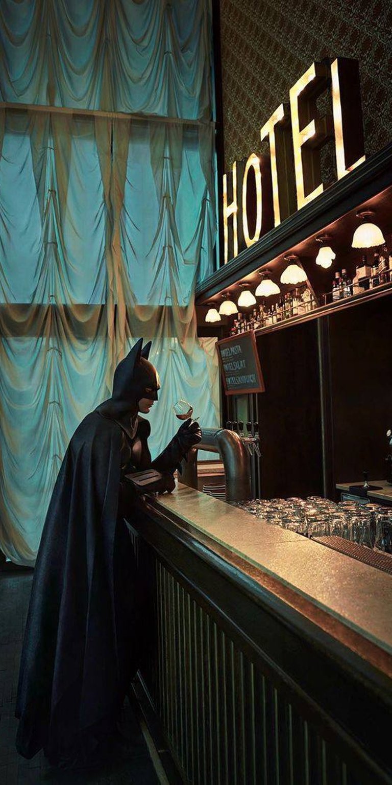 Batman in a hotel bar holding wine glass wallpaper 4k