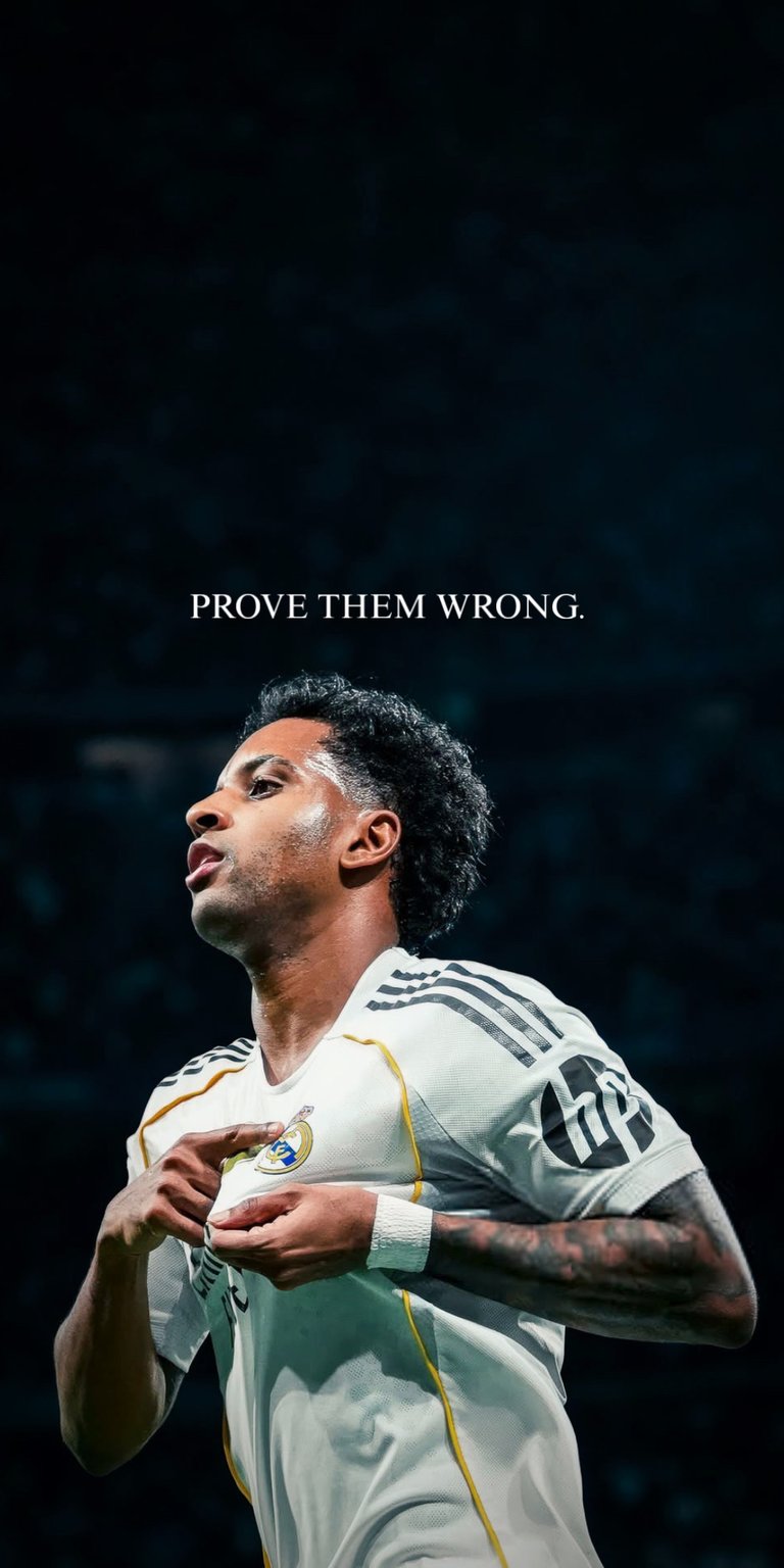 Showcase your team pride with this compelling live wallpaper featuring Real Madrid star forward, Rodrygo Goes. The wallpaper includes the powerful and defiant quote, "PROVE THEM WRONG," perfectly encapsulating the spirit of this young athlete. The dynamic imagery and sleek design make it a must-have for all Real Madrid supporters and soccer fans who appreciate raw talent and determination. Get this stunning wallpaper and be inspired by the champions' mentality!