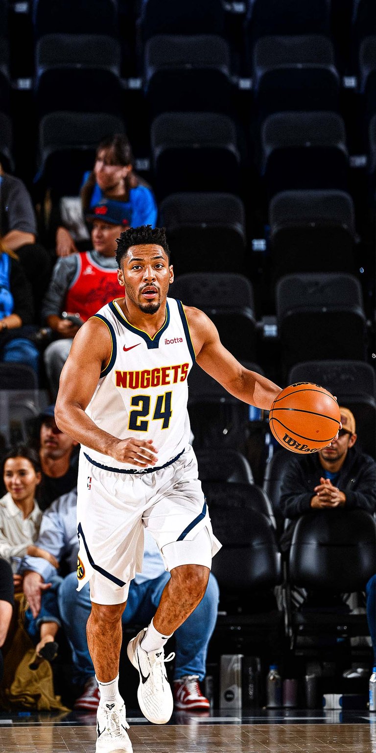 Jalen Pickett of the Denver Nuggets dribbles the ball Wallpaper