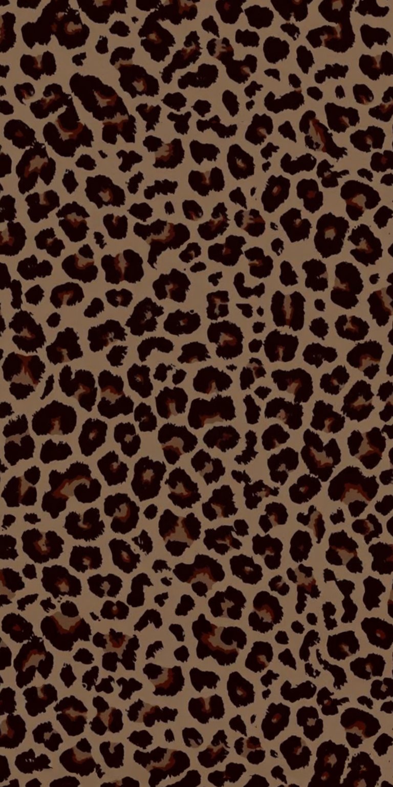 This 4K leopard wallpaper features a tan background patterned with dark brown spots, perfect for your iPhone. Get this eye-catching wallpaper that showcases a pattern of clustered rosettes and blurred edges.