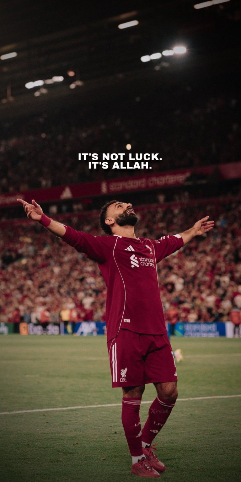 A powerful and atmospheric photo of Liverpool FC star Mohamed Salah celebrating a goal, featuring the motivational quote: "IT'S NOT LUCK. IT'S ALLAH." This image captures the deep faith and dedication of the professional footballer. Perfect for football fans, athletes, and anyone seeking daily inspiration rooted in their beliefs.