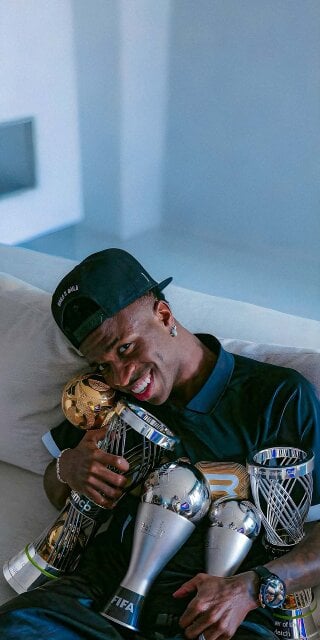 Vinicius Jr with His Trophies Wallpaper iPhone HD