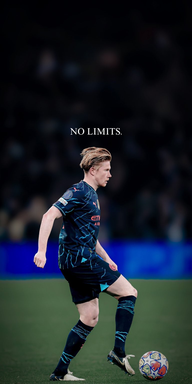 Showcase the brilliance of KDB with this stunning Manchester City 4K wallpaper. Featuring De Bruyne in the sleek dark blue City away kit, the image includes the bold "NO LIMITS" typography. Captured in mid-action during a Champions League night, this wallpaper embodies the technical precision and drive of the world’s best midfielder.