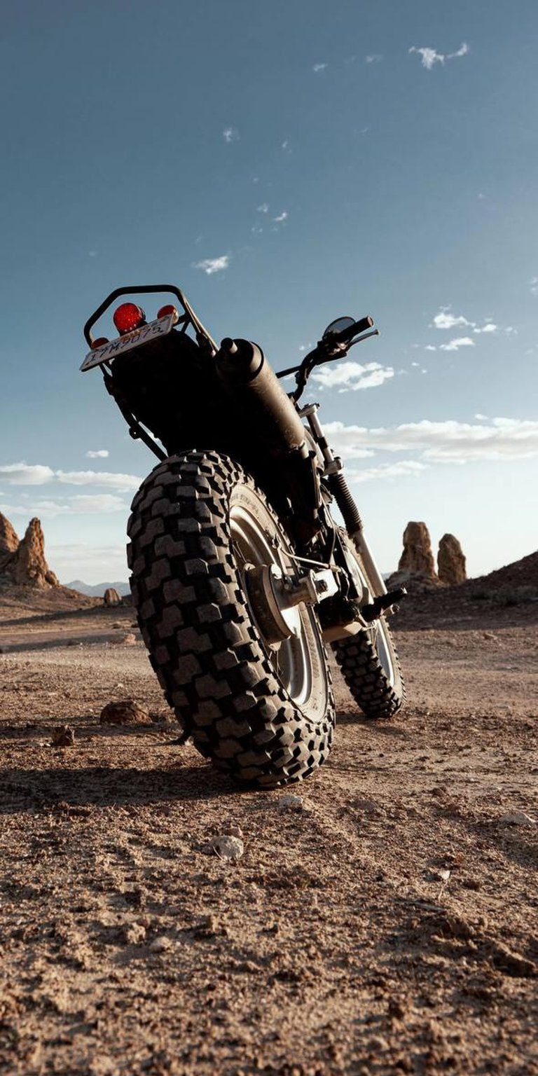 Motorbike park in the terrain mobile wallpaper