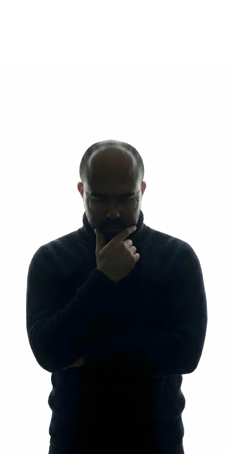 An aesthetic wallpaper featuring the viral Danny Slicer silhouette in a contemplative hand-on-chin pose. This high-contrast iPhone wallpaper utilizes sharp rim lighting and deep shadows against a clean white background.