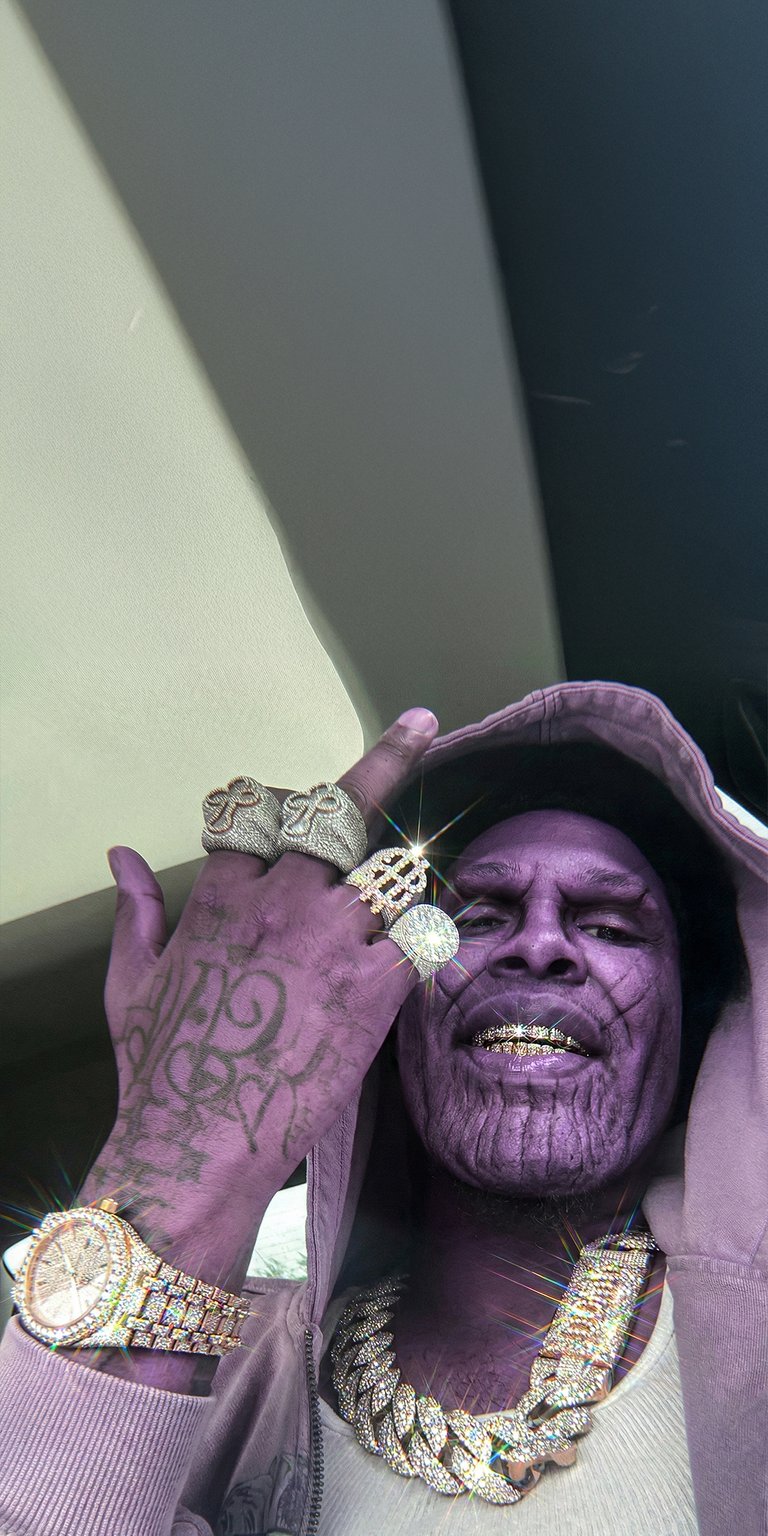 This unique 4K aesthetic wallpaper features a purple-hued Thanos mashup decked out in glittering diamond chains and rings. Perfect for your iPhone, this wallpaper uses sharp lighting and vibrant jewelry glints to create a bold, high-energy mood.