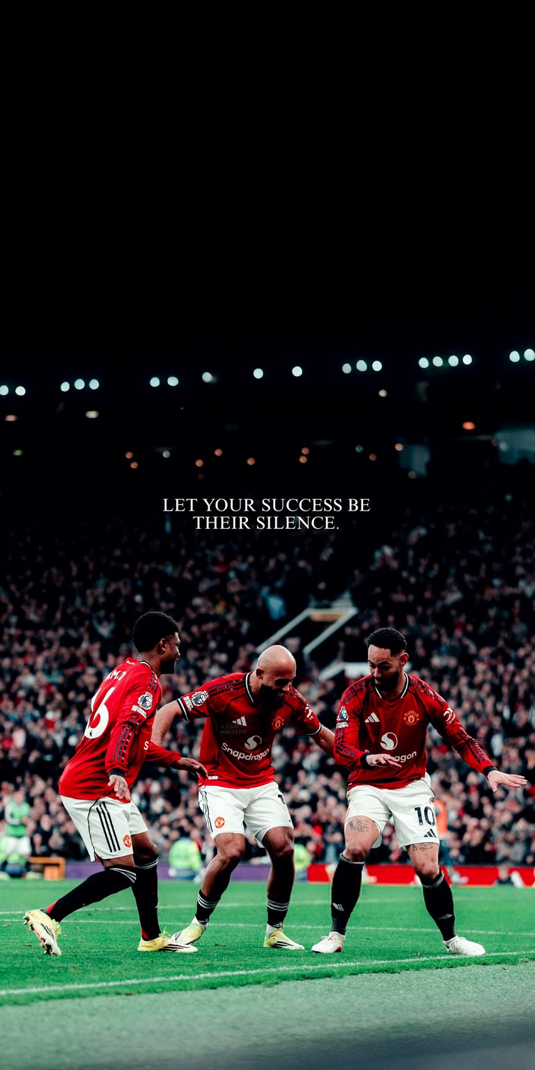 This Manchester United 4K wallpaper features a vibrant red kit celebration set against a deep black sky, perfect for your iPhone. Part of our OLED wallpapers collection, it showcases sharp contrast, dramatic stadium lighting, and a motivational quote.