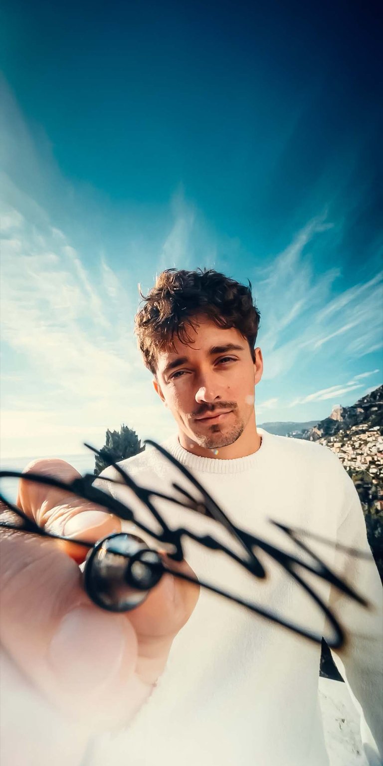 Charles Leclerc signing wallpaper iPhone 4K