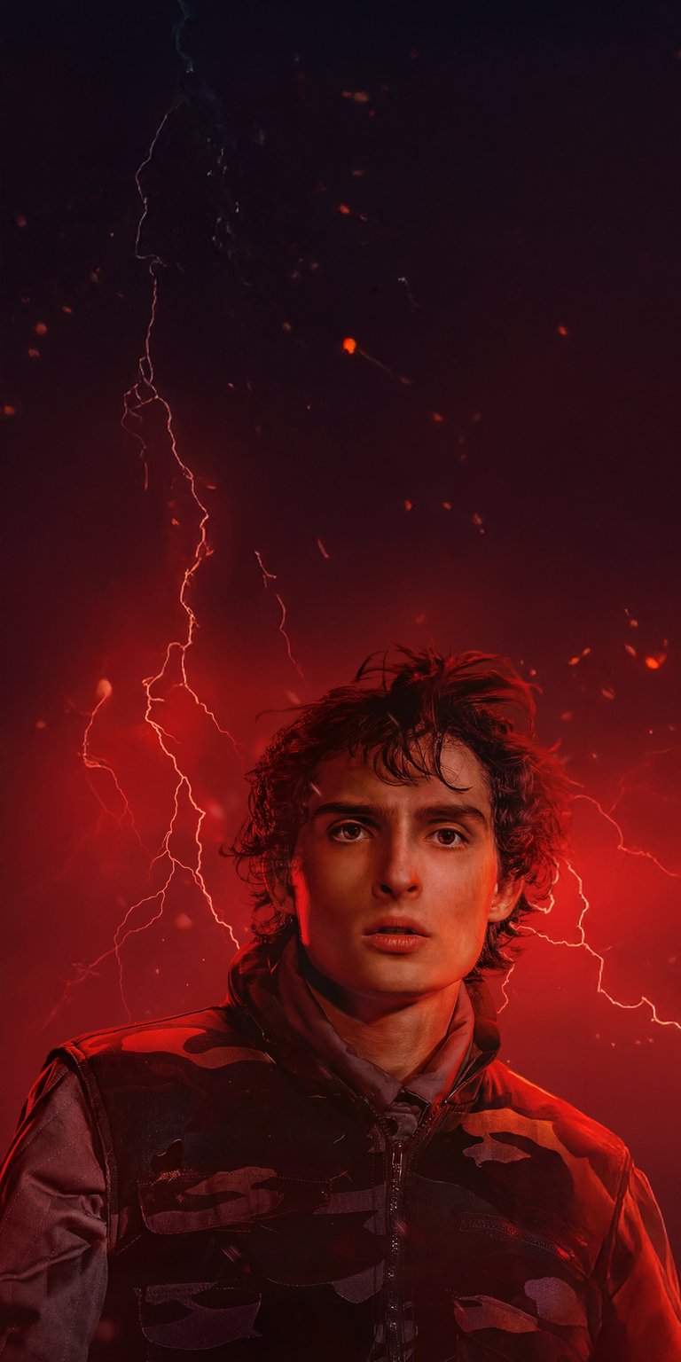 This 4K wallpaper features Mike Wheeler against a fiery red background with lightning. Download this wallpaper for your iPhone and enjoy the details of his camo jacket and curly hair.