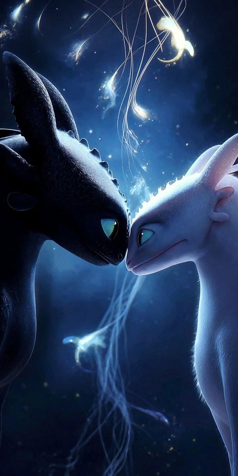 Get this beautiful Toothless and Light Fury 4K wallpaper for your iPhone! This wallpaper features a pair of dragons with glowing blue accents and delicate light tendrils.