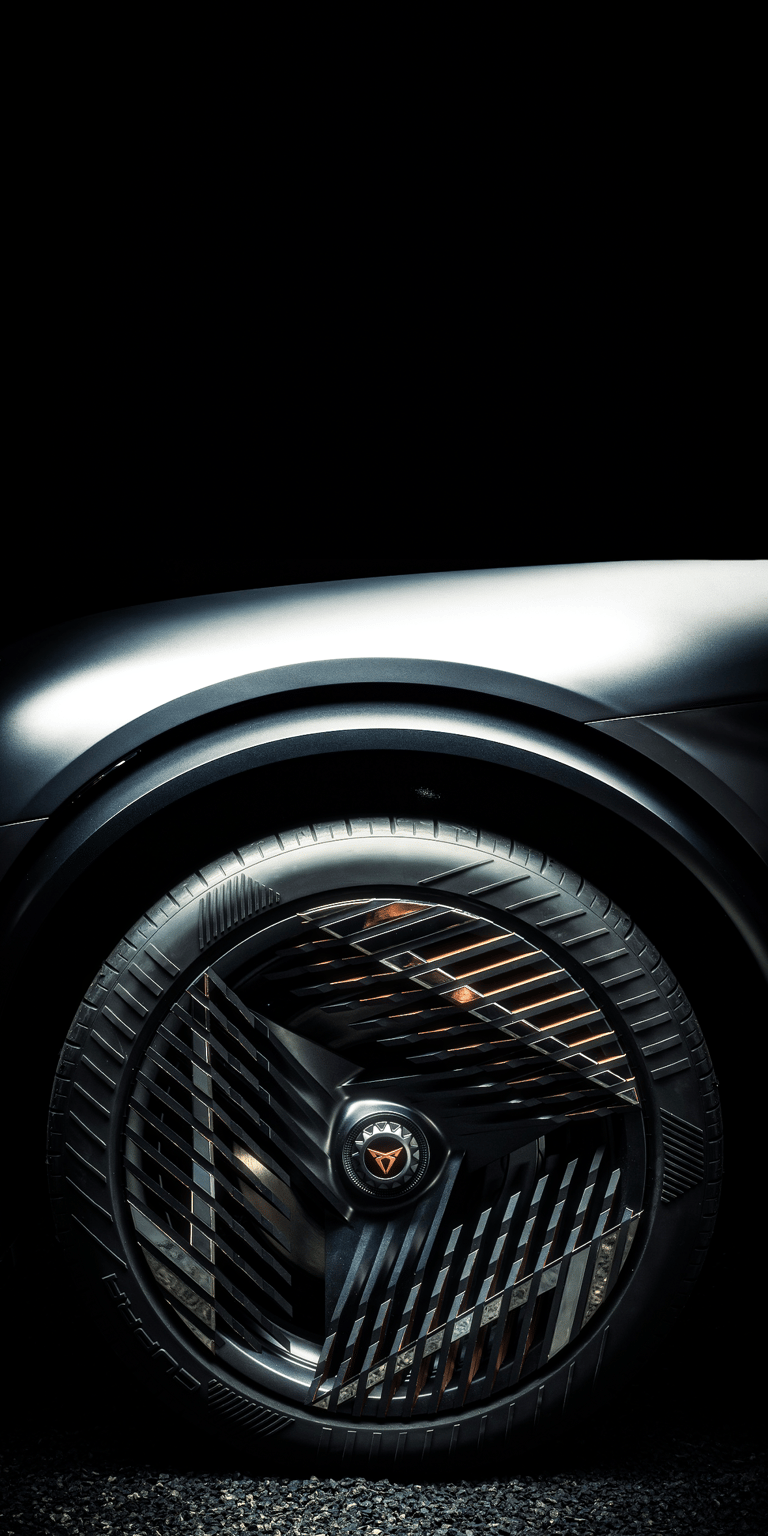 A detailed close-up Cupra DarkRebel wallpaper focusing on the parametric copper-accented rim design. This minimalist wallpaper offers a clean, sophisticated automotive aesthetic for your iPhone.
